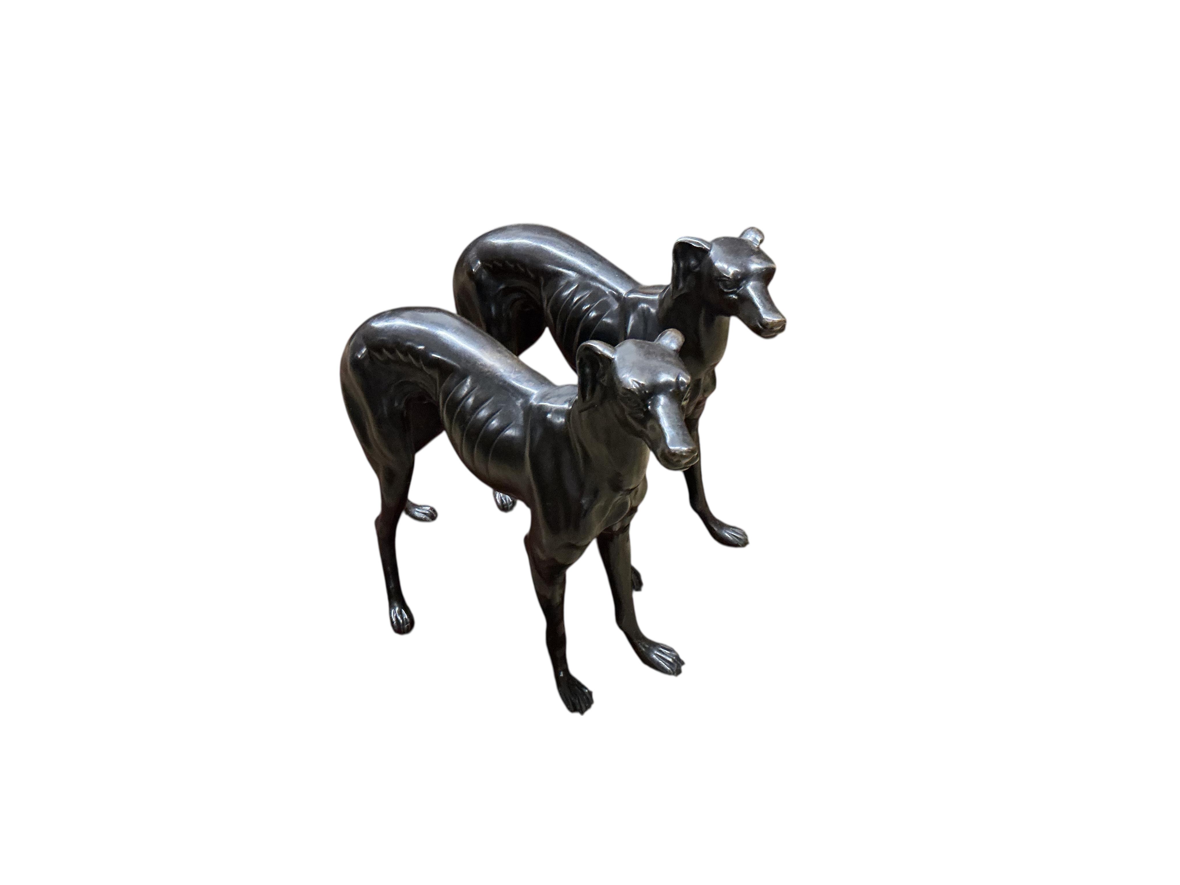 A pair of modern bronze models of greyhounds, length 70cm, height 51cm